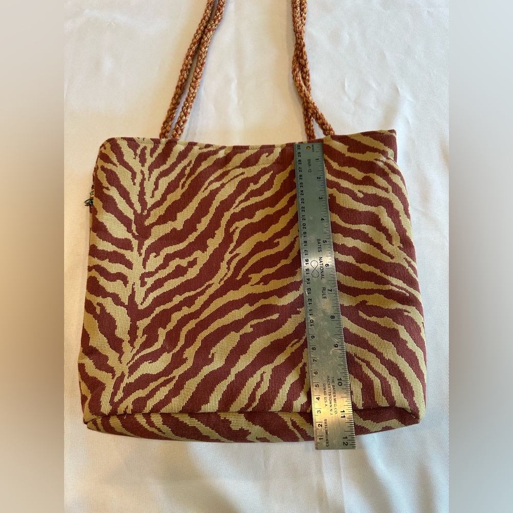 Stylish Maroon and Tan Zebra Tote Bag with Tassel Detail - Picture 7 of 10